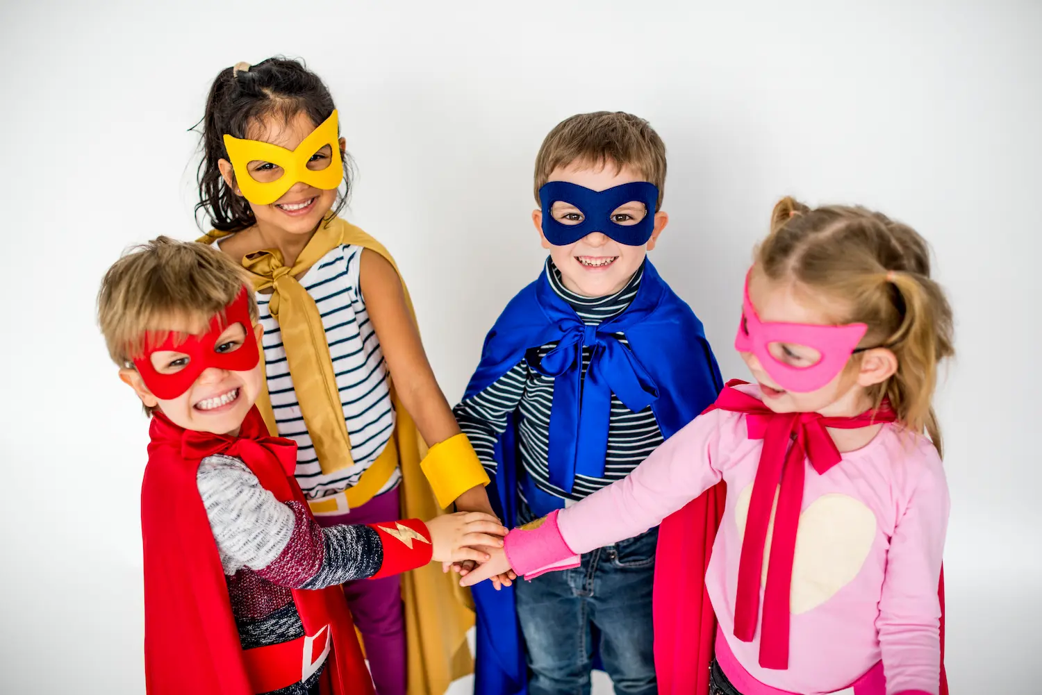 Kids playing superheroes together